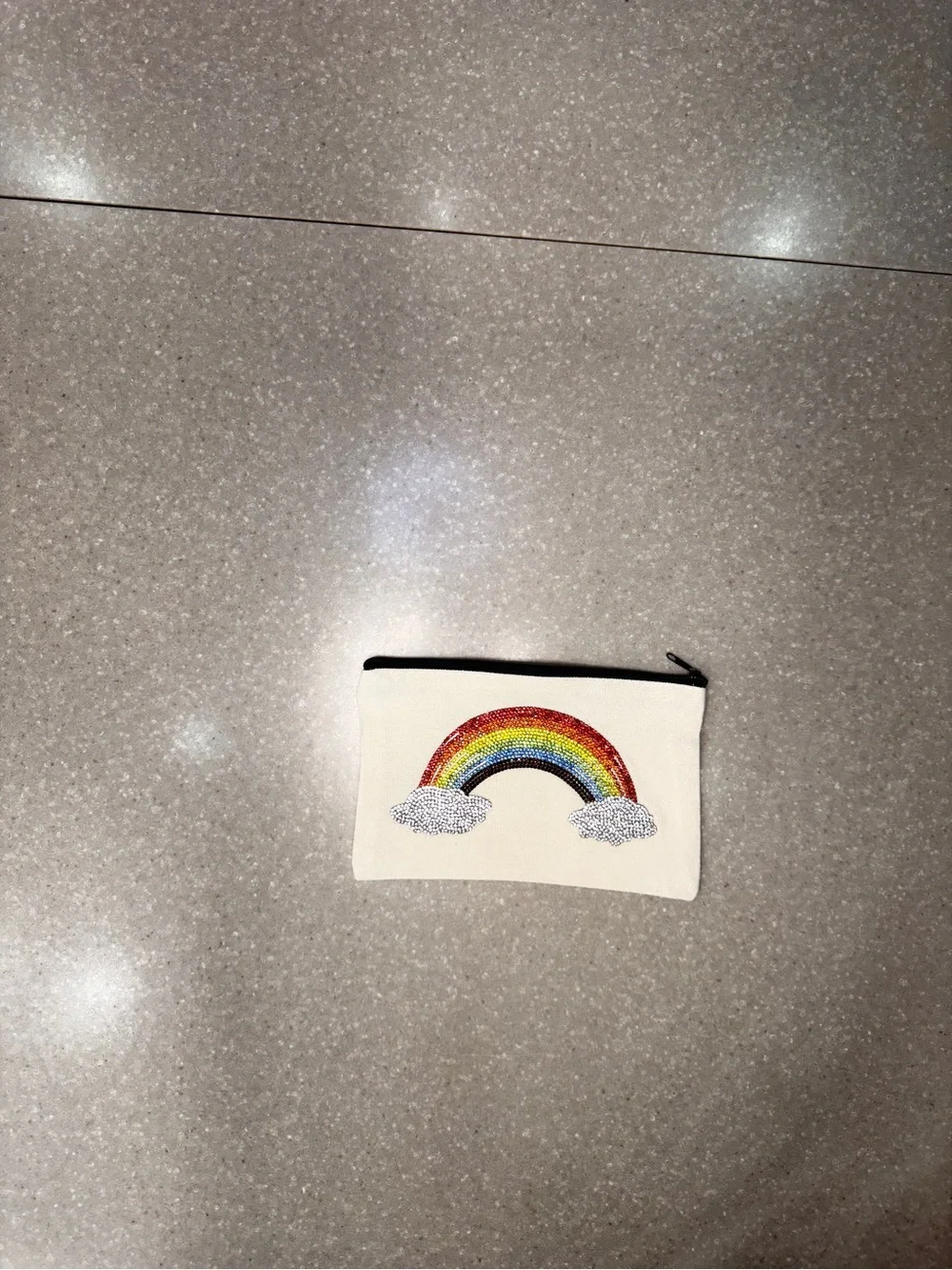 Cosmetic bag with rainbow.  Design is on both sides.  8 x 5